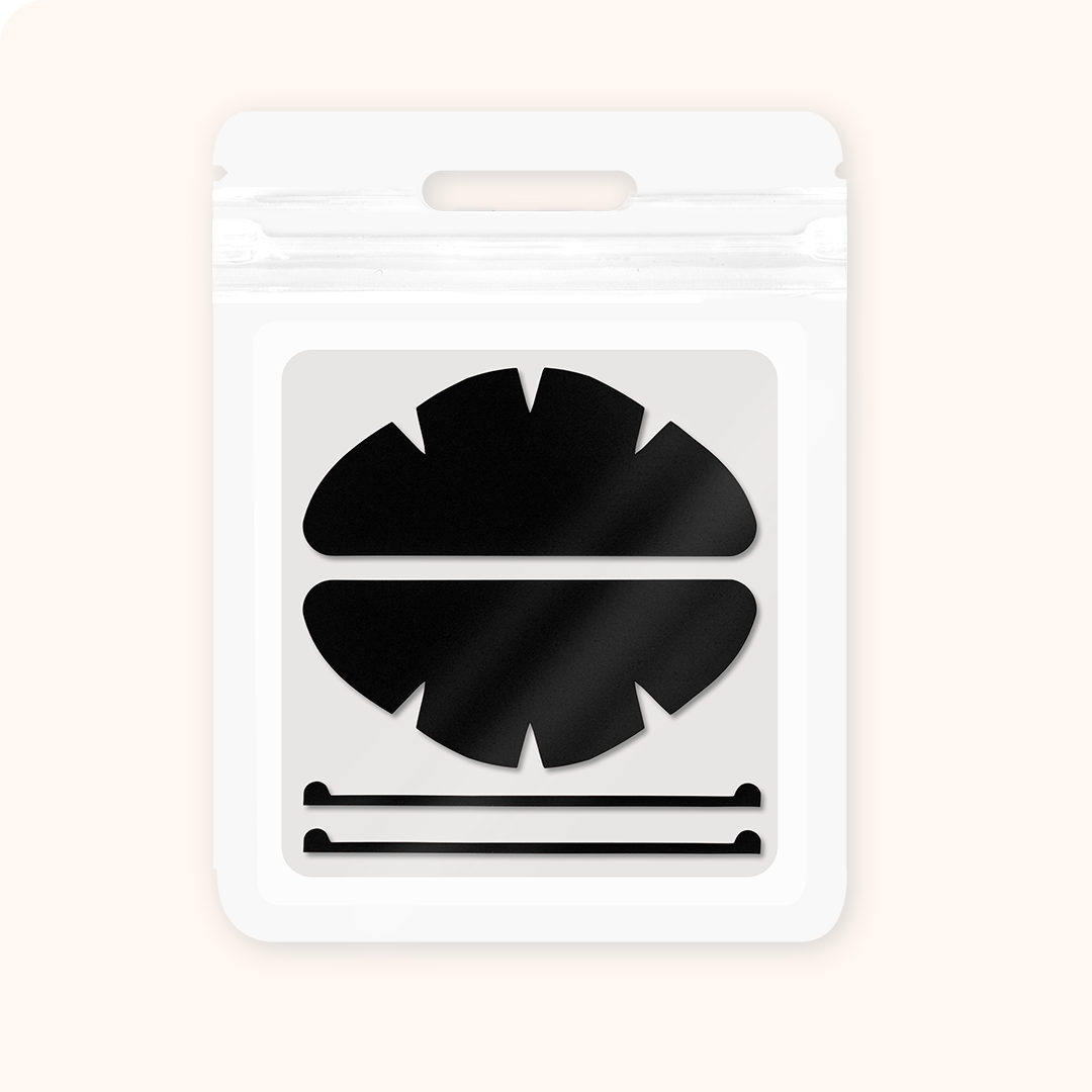 Reusable dual-use silicone lash shields with fixing strips. UV protection for lash curing + lash isolation for perm services, soft ergonomic fit for professional salon use.