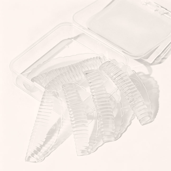 Professional reusable silicone lash lift pads in 4 sizes & 3 colors. Skin-friendly material with groove design for even curls, salon lash lift services.
