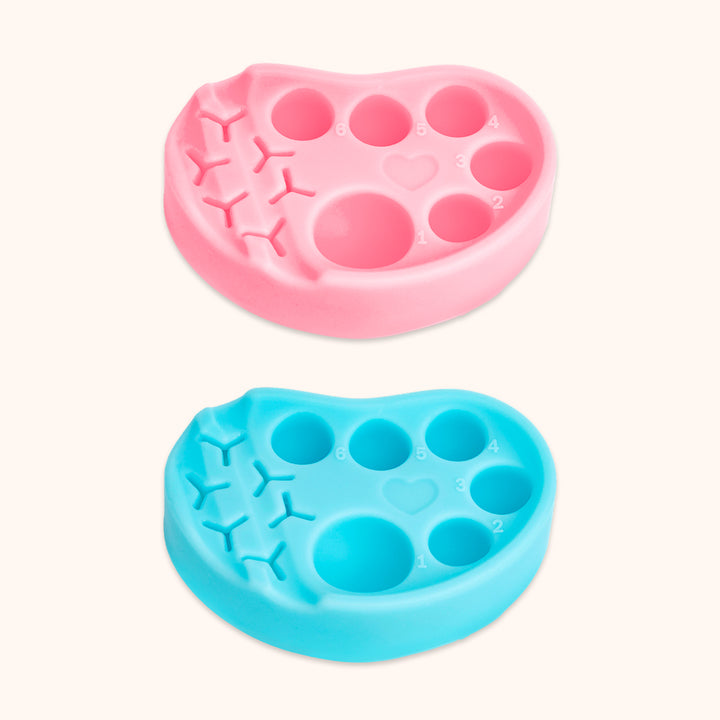 Reusable silicone lash lift palette with 6 glue wells and tool holders. Organizes perm lotion, fixer, glue and tools, ideal for professional lash perm and tint services.