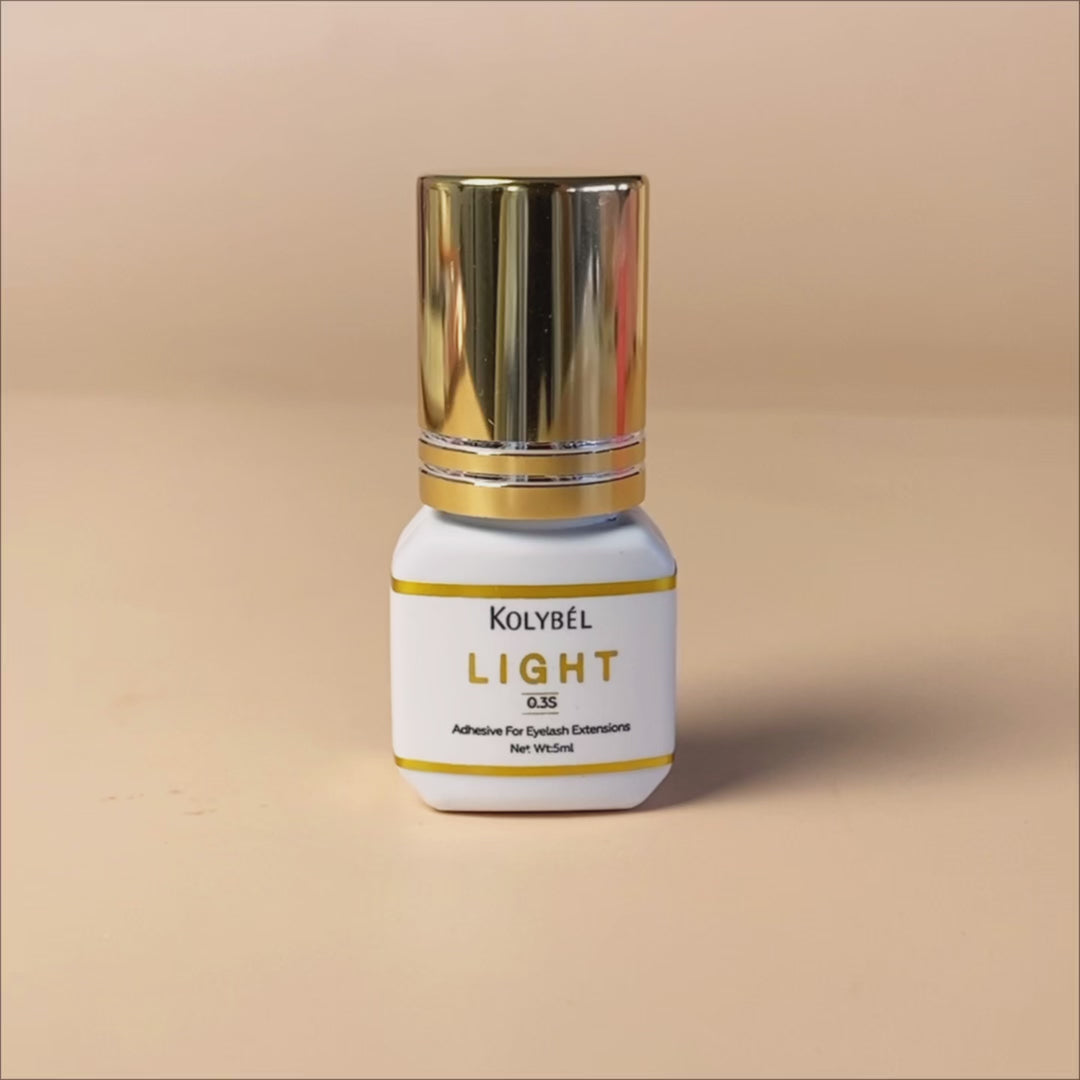 0.3 Second LIGHT Adhesive Eyelash Extension Glue (5ml)-kolybel-This professional eyelash extension adhesive offers ultra-fast 0.3 second drying time and long-lasting retention for experienced lash artists. Its non-toxic formula with glossy black finish is designed for use in controlled salon conditions to create durable, natural-looking lash sets.