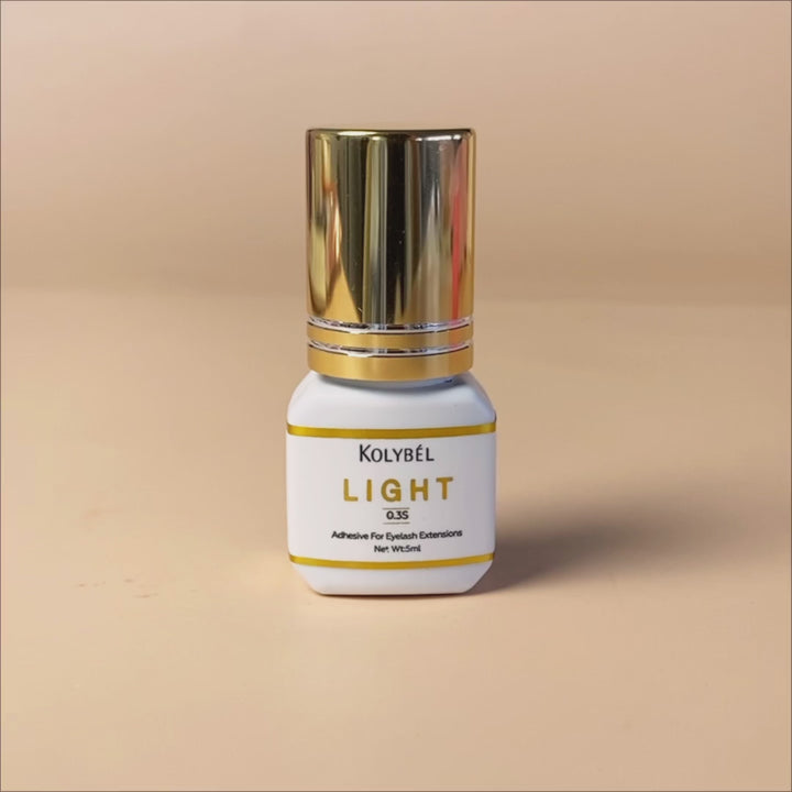 0.3 Second LIGHT Adhesive Eyelash Extension Glue (5ml)-kolybel-This professional eyelash extension adhesive offers ultra-fast 0.3 second drying time and long-lasting retention for experienced lash artists. Its non-toxic formula with glossy black finish is designed for use in controlled salon conditions to create durable, natural-looking lash sets.